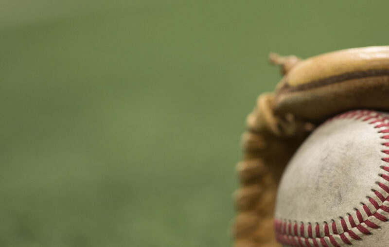 Old Baseball inside of baseball glove