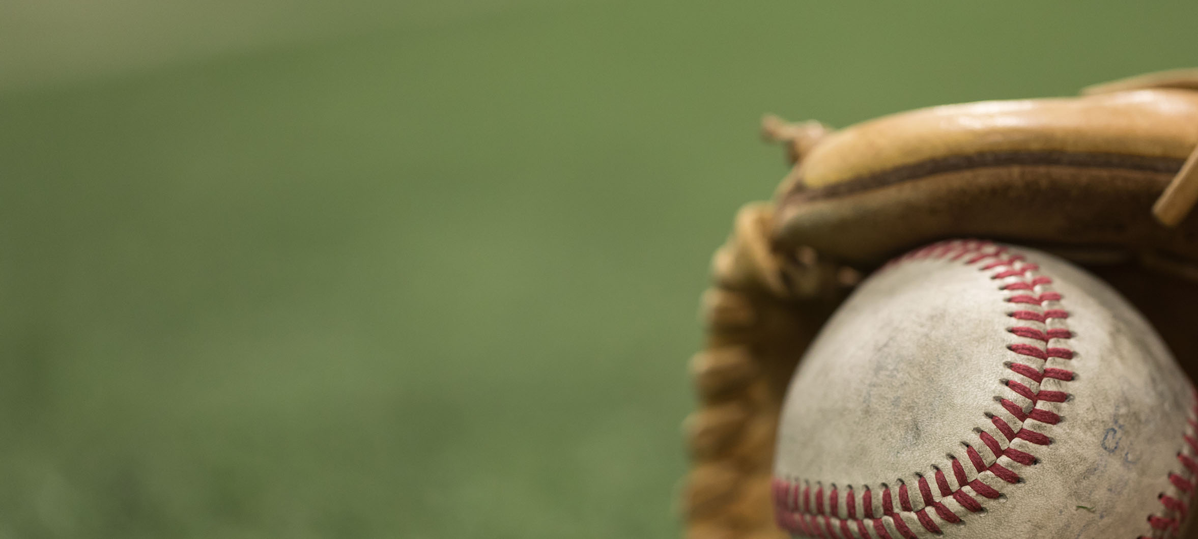 Old Baseball inside of baseball glove