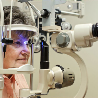 elderly woman undergoing eye treatment or checkup