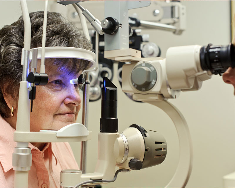 elderly woman undergoing eye treatment or checkup